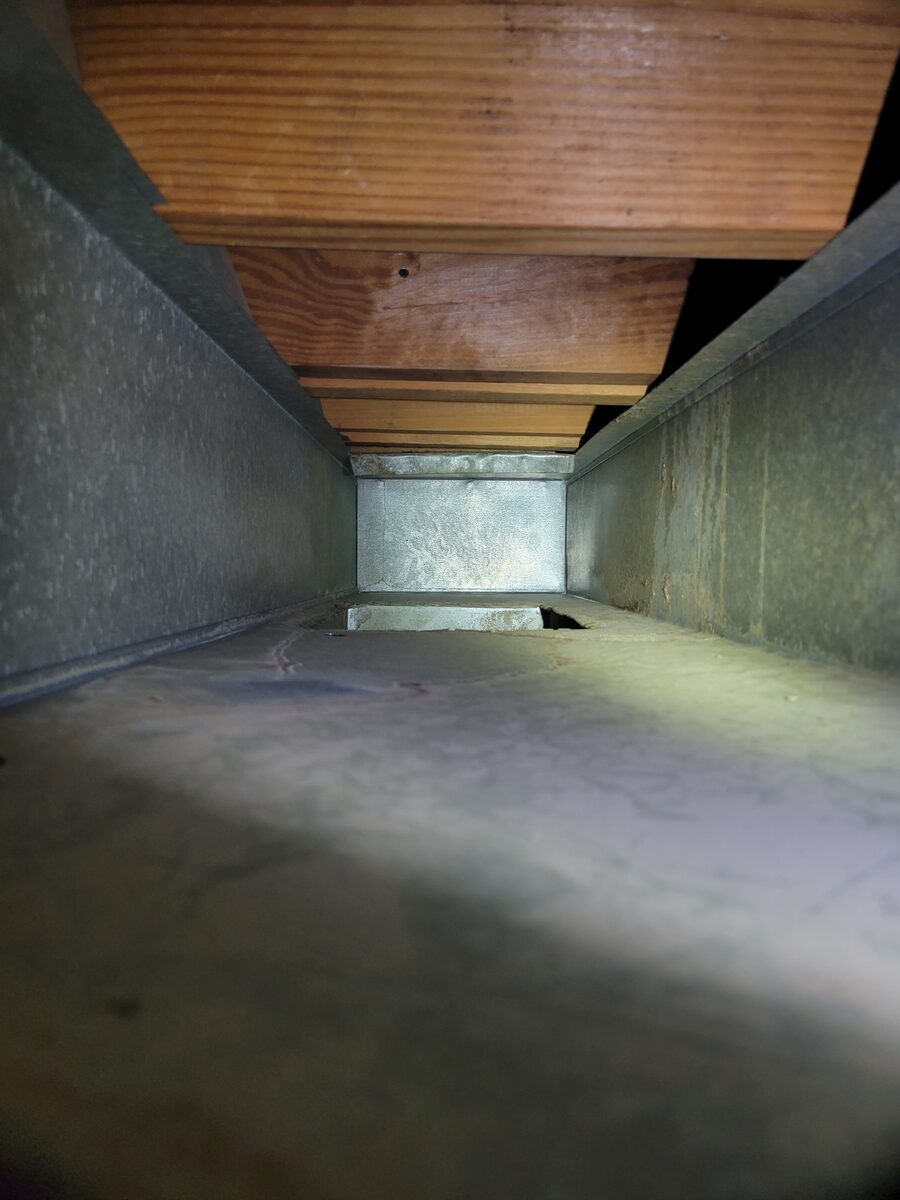 The same duct cleaned end to end down to bare metal seams