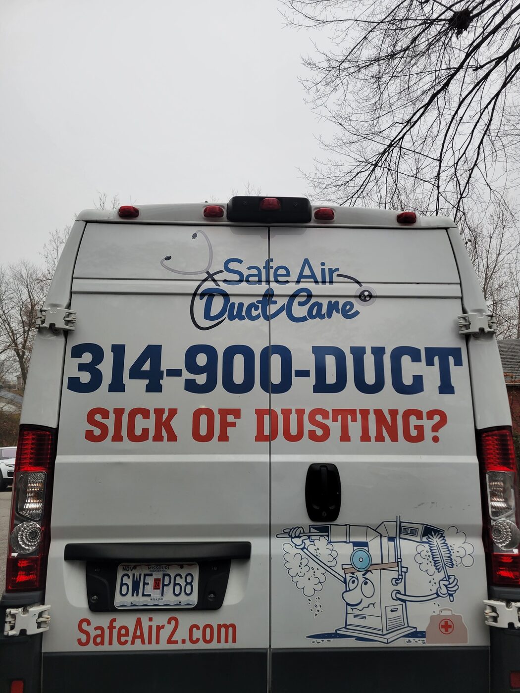 Professional rotary brush and vacuum equipment inside a SafeAir Duct Care van, used to clear the full dryer vent run